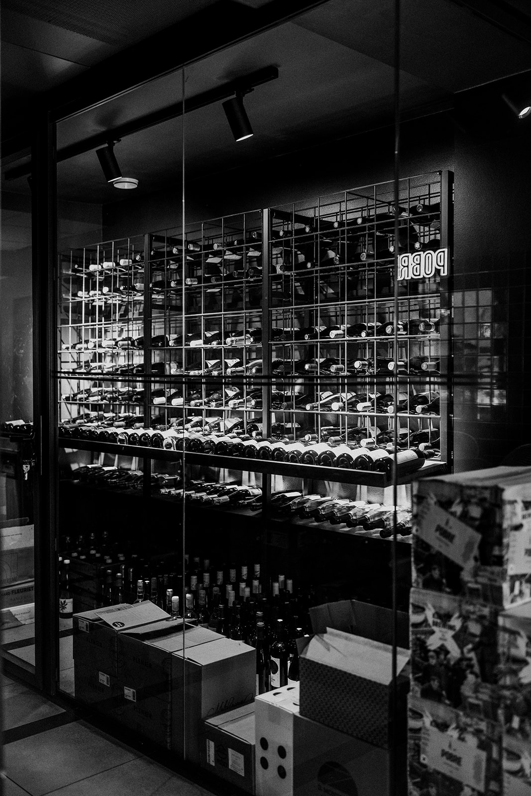 Bottles racked in Pobre's wine cellar — the Spanish side of the pantry.